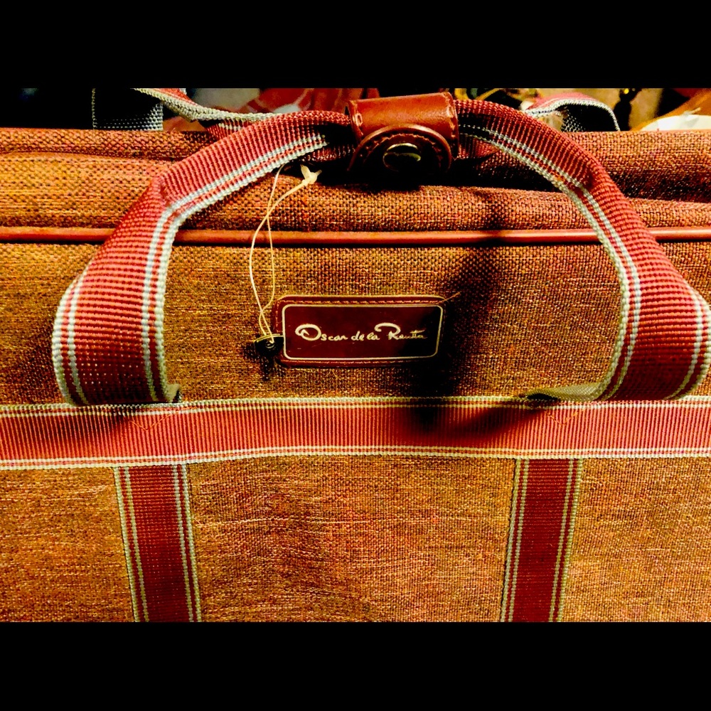 Vintage luggage by Oscar de la Renta! Blue gray accents. Measures 23x13